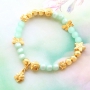 Schmuck in mintgr&uuml;nen T&ouml;nen von Polaris Elements Perlen mit goldenen Details 